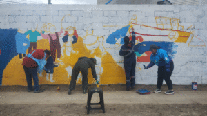 Pedagogía en Historia UMAG le cambia la cara al Archipiélago de Chiloé con mural